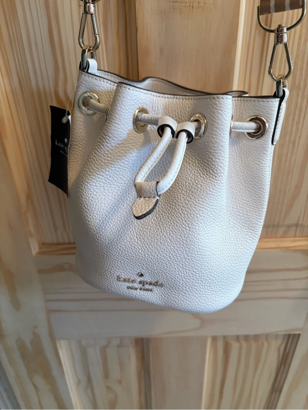 kate spade Cream Pebbled Leather Drawstring Crossbody with Striped Strap